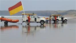 Lifeguards on duty on Perranporth Beach, moving with the tide